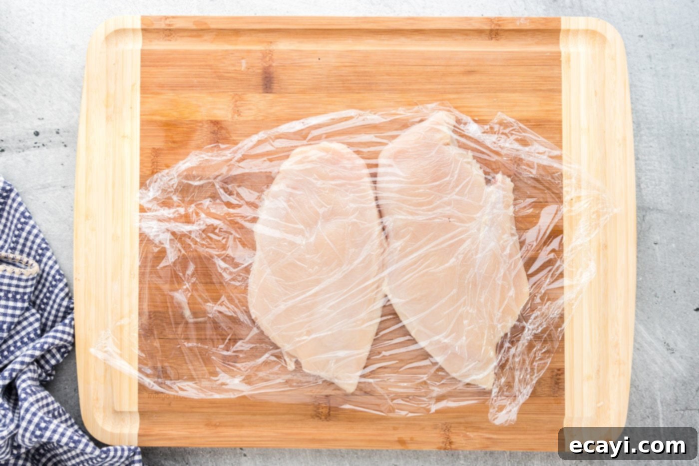 Golden Lemon Chicken 5 chicken breasts covered with plastic wrap