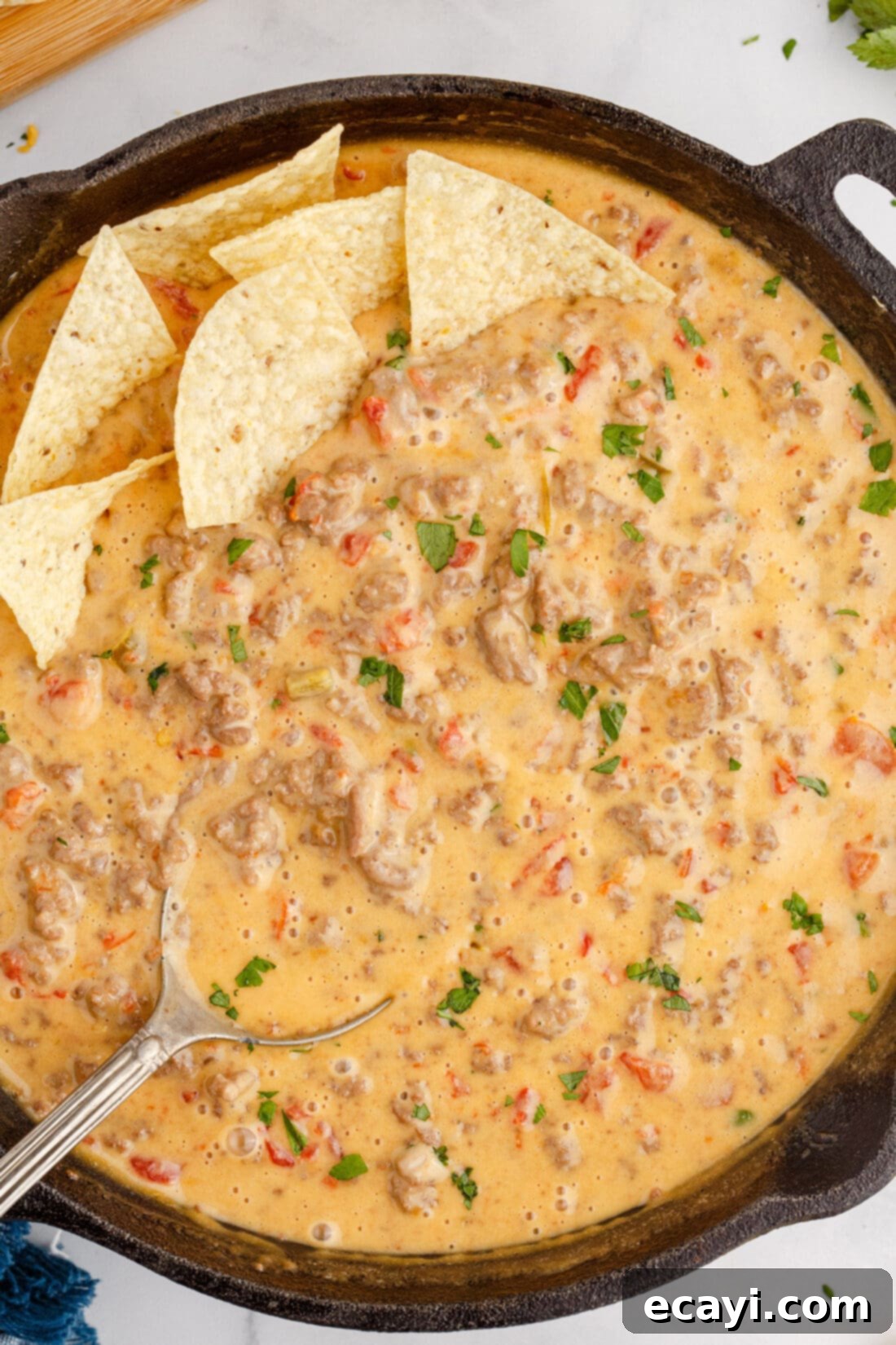 Spicy Creamy Party Queso 2 skillet of Rotel Dip, a creamy, cheesy party appetizer