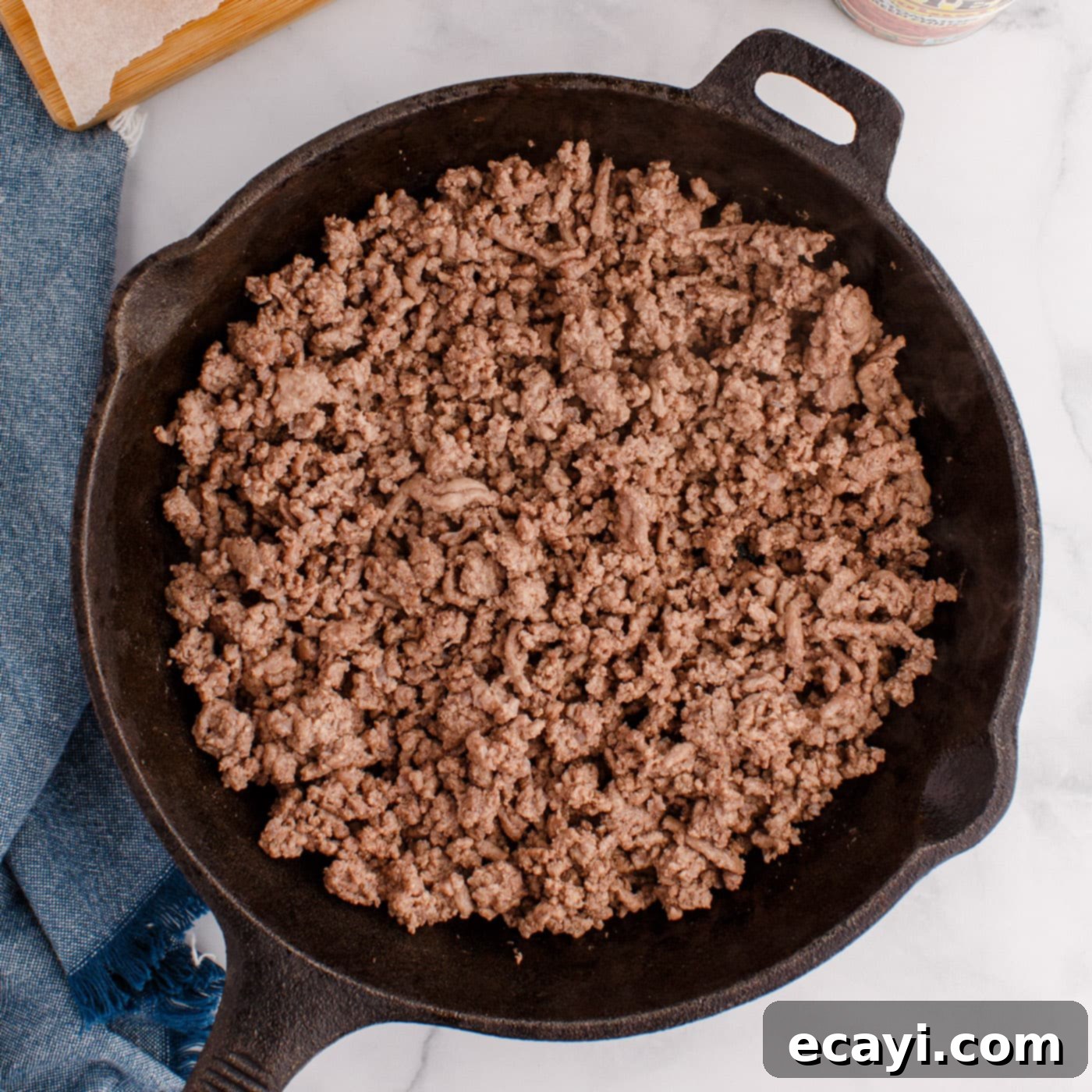 Spicy Creamy Party Queso 5 browned ground beef in a skillet, ready for the next step of Rotel Dip
