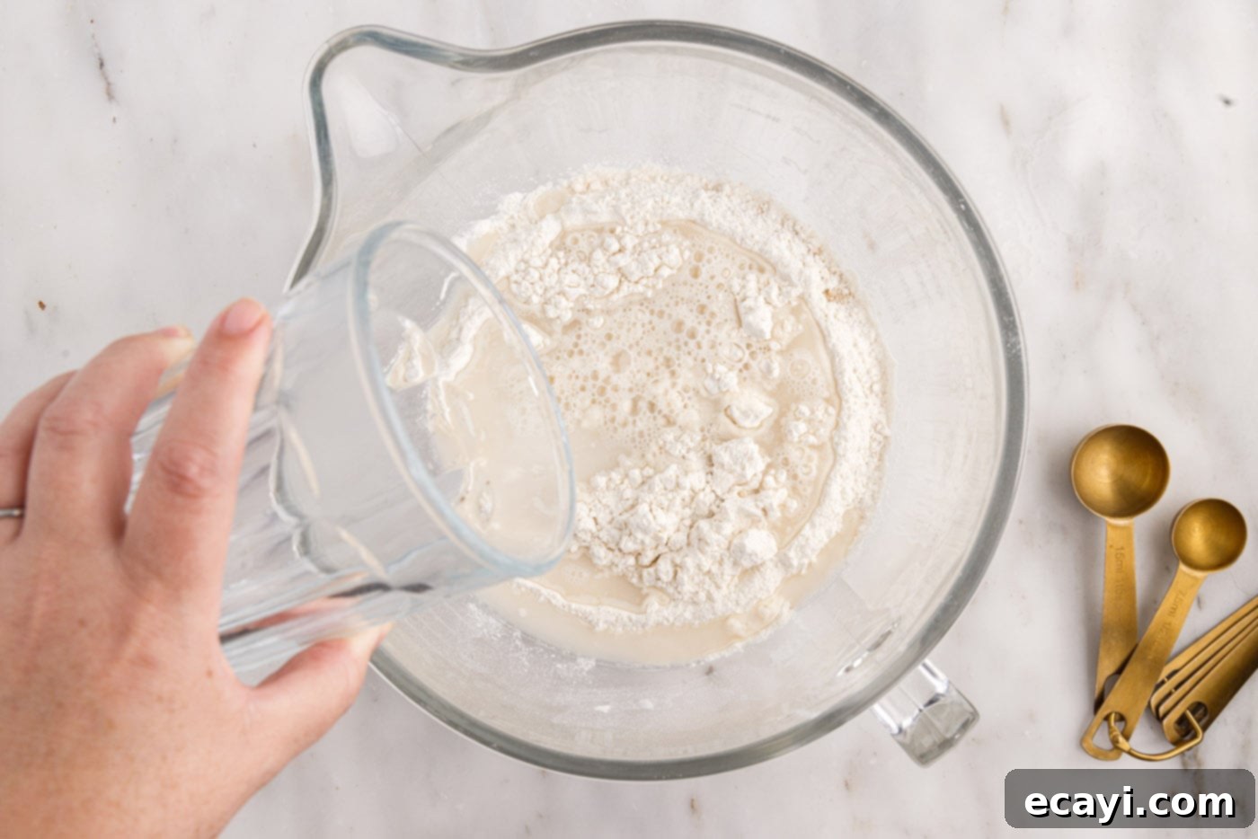 The Perfect Cast-Iron Loaf 6 adding water to yeast mixture in bowl