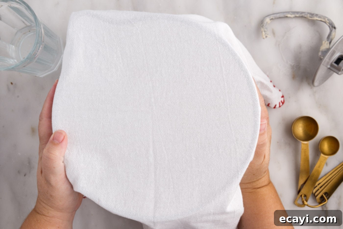 The Perfect Cast-Iron Loaf 9 covering bread dough with a kitchen towel