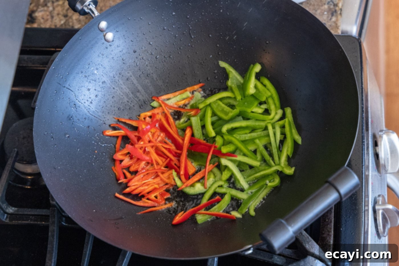 Fiery Szechuan Beef 9 Red jalapenos and green peppers stir-frying in a hot wok