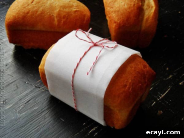 Amish White Bread Mini Loaves - AmandasCookin.com A photo of a wrapped Amish white bread mini loaf.