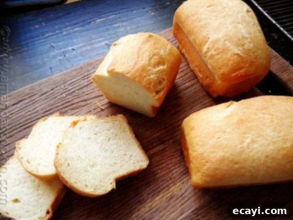 Amish White Bread Mini Loaves - AmandasCookin.com A photo of a sliced Amish white bread mini loaves.