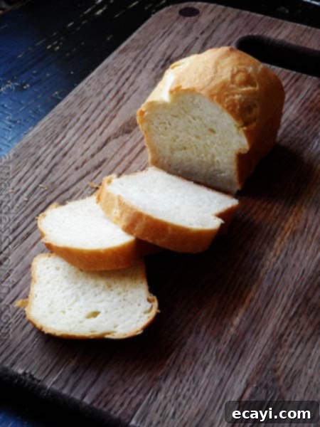 Amish White Bread Mini Loaves - AmandasCookin.com A photo of a sliced Amish white bread mini loaf.