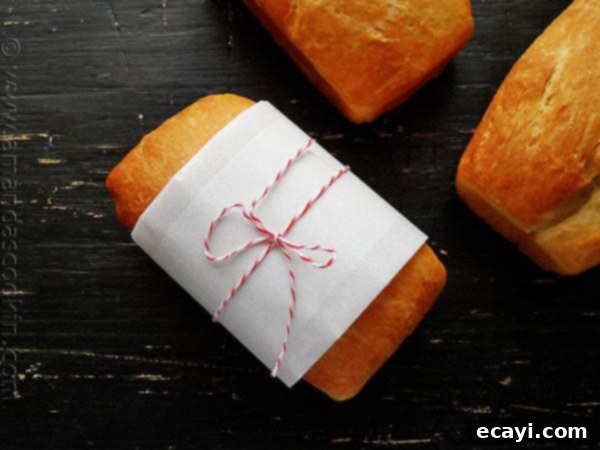 Amish White Bread Mini Loaves - AmandasCookin.com A photo of a wrapped Amish white bread mini loaf.