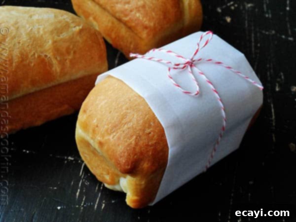 Amish White Bread Mini Loaves - AmandasCookin.com A photo of a wrapped Amish white bread mini loaf.