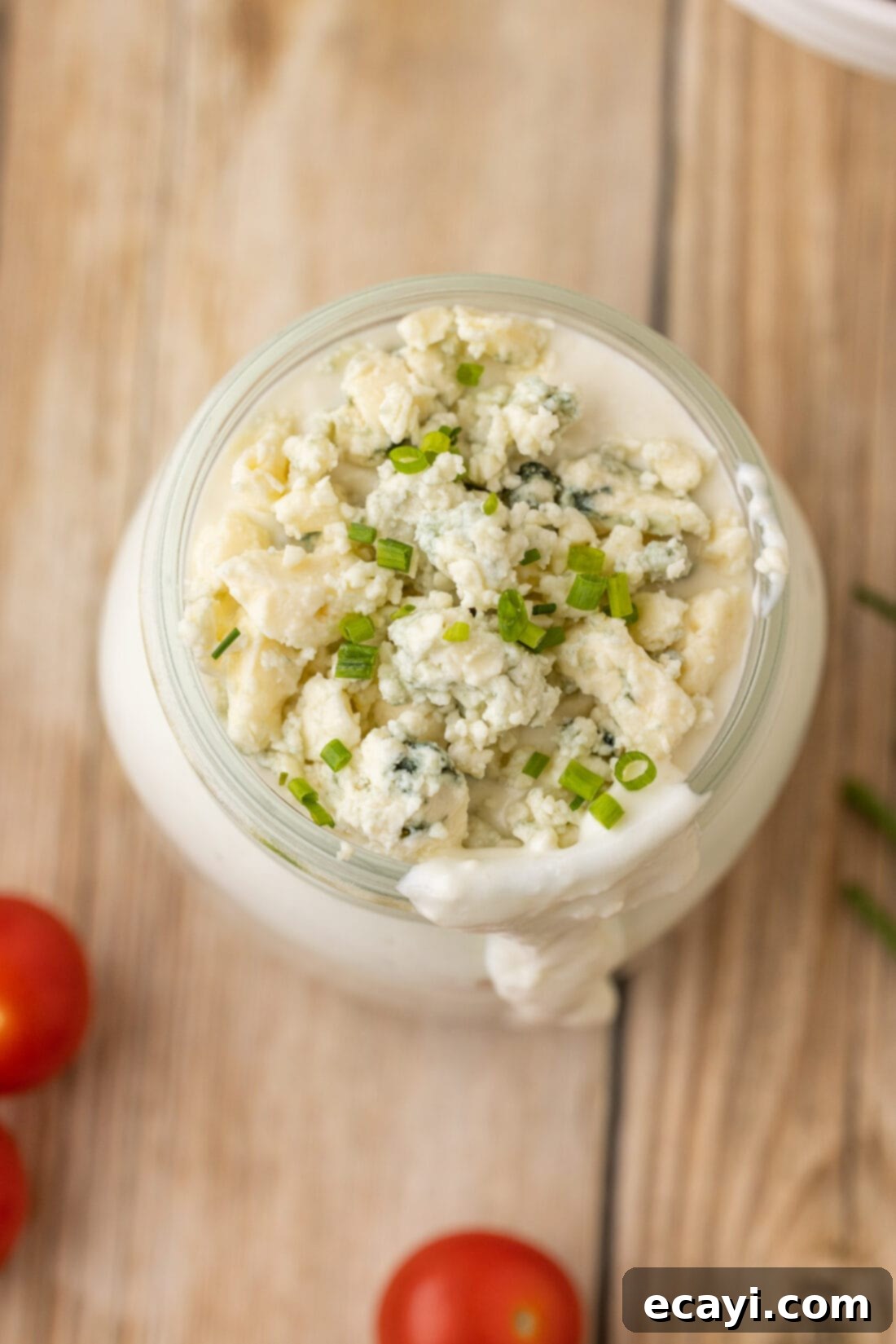 Classic Blue Cheese Dressing 3 Overhead shot of a mason jar filled with creamy blue cheese dressing, ready to be served.