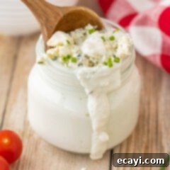 Classic Blue Cheese Dressing 8 Creamy Homemade Blue Cheese Dressing in a jar with a rustic white background.