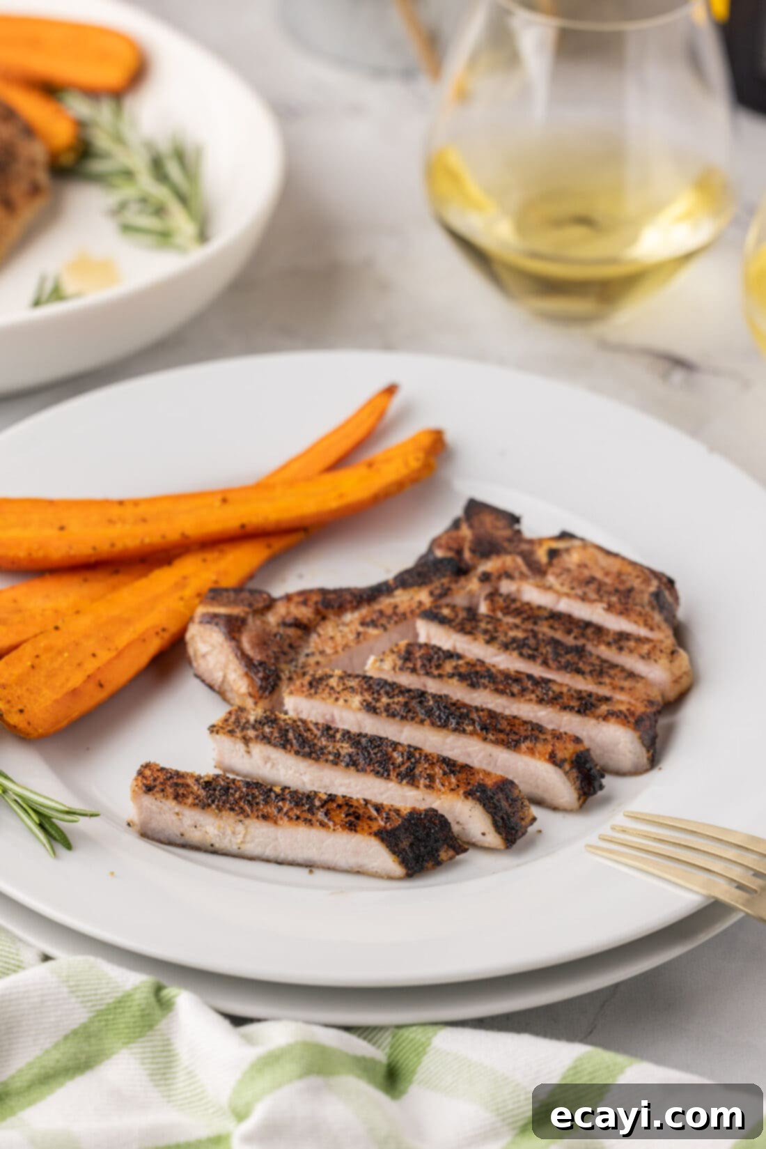 Meltingly Tender Sous Vide Pork Chops 12 plate of sliced Sous Vide Pork Chop