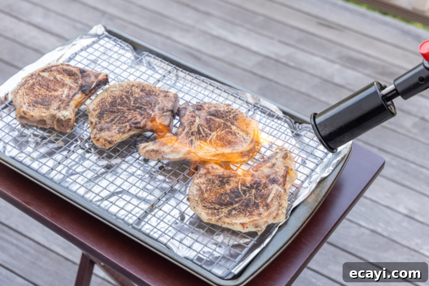 Meltingly Tender Sous Vide Pork Chops 10 searing pork chops with a kitchen torch