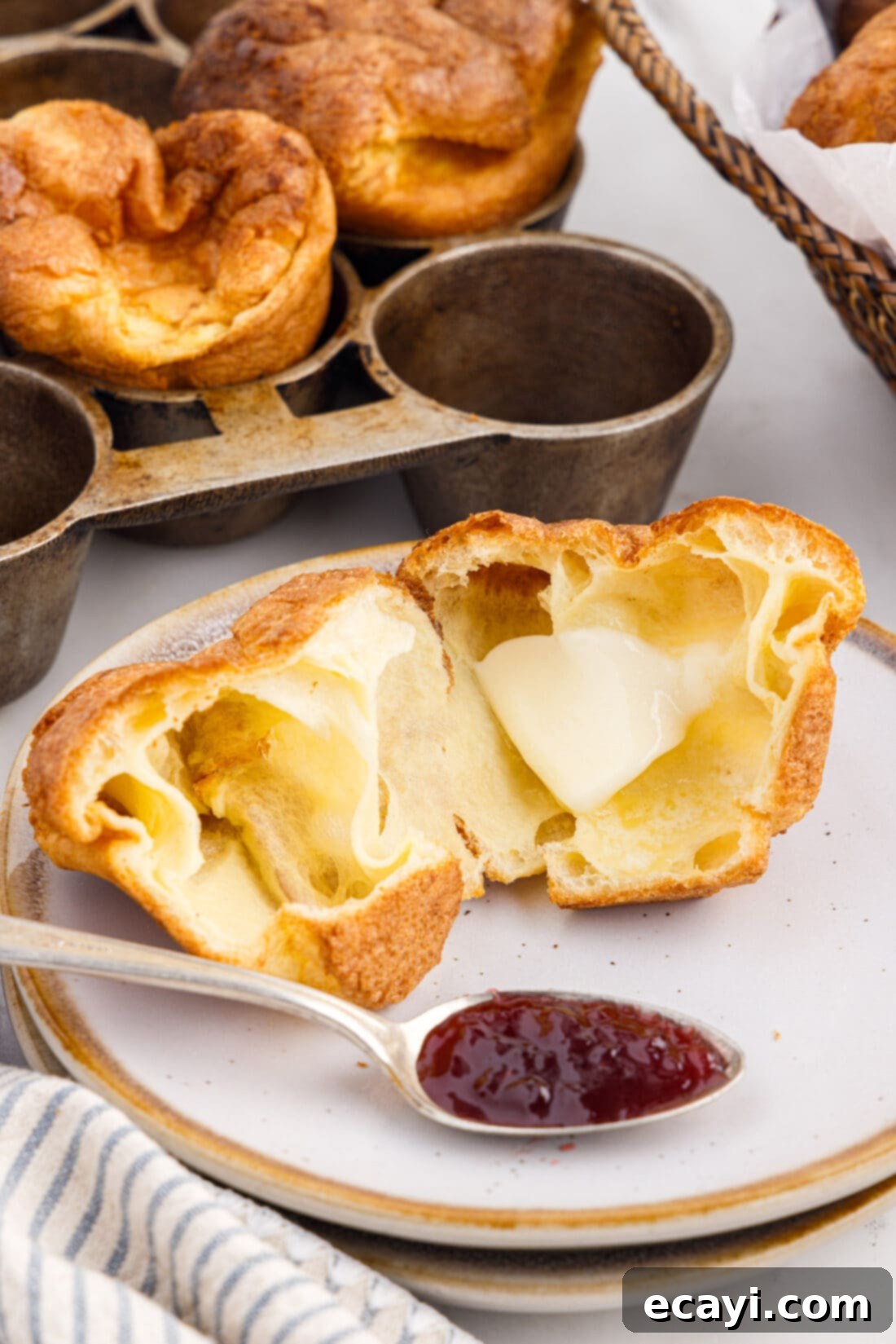 Light and Airy Popovers 11 Freshly baked popover with butter and jam, ready to be enjoyed