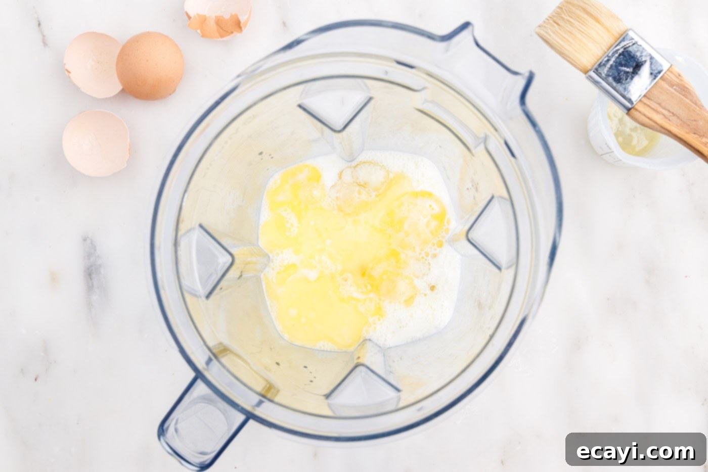 Light and Airy Popovers 5 Popover ingredients in a blender, ready to be mixed