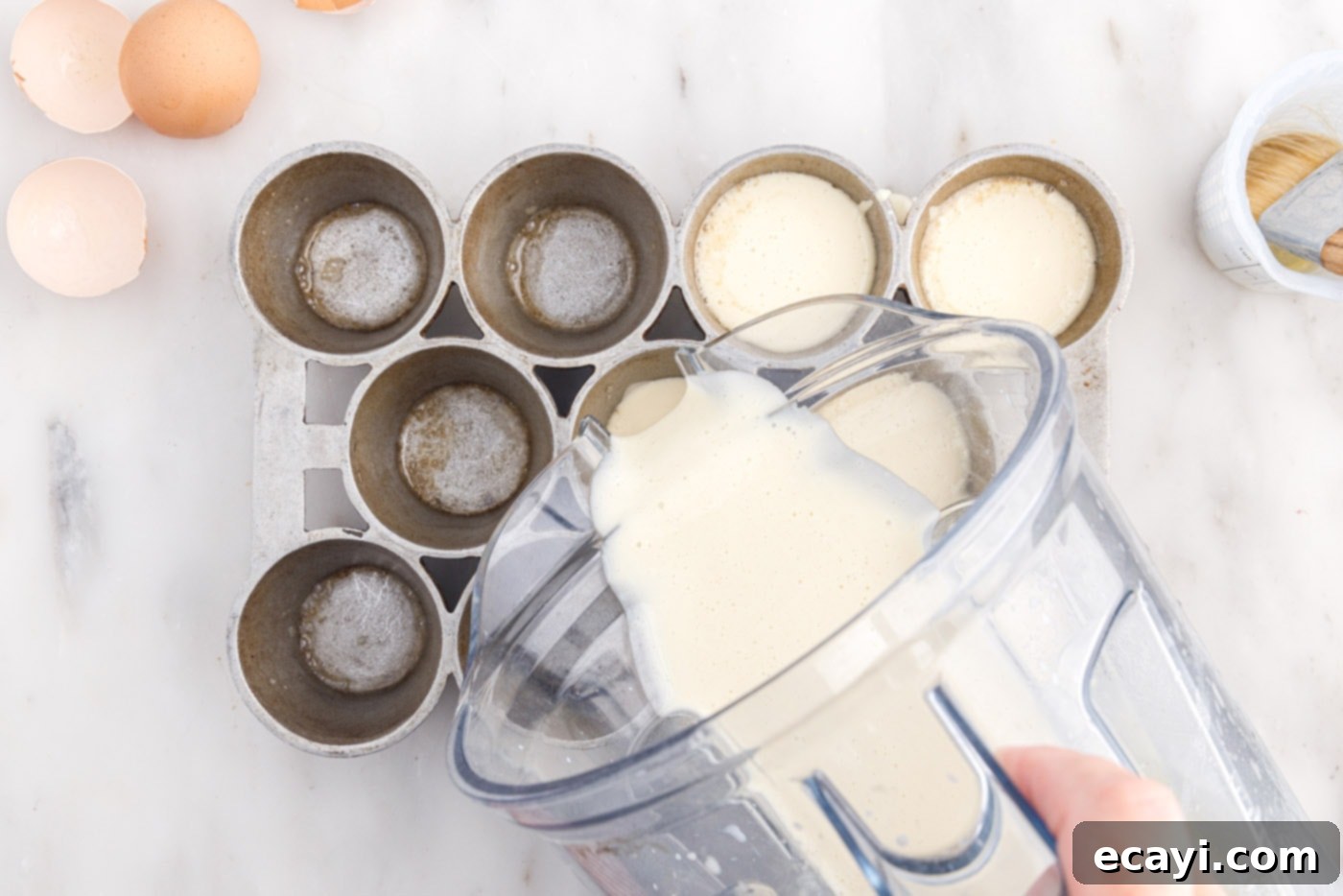Light and Airy Popovers 9 Pouring popover batter into a hot popover tin