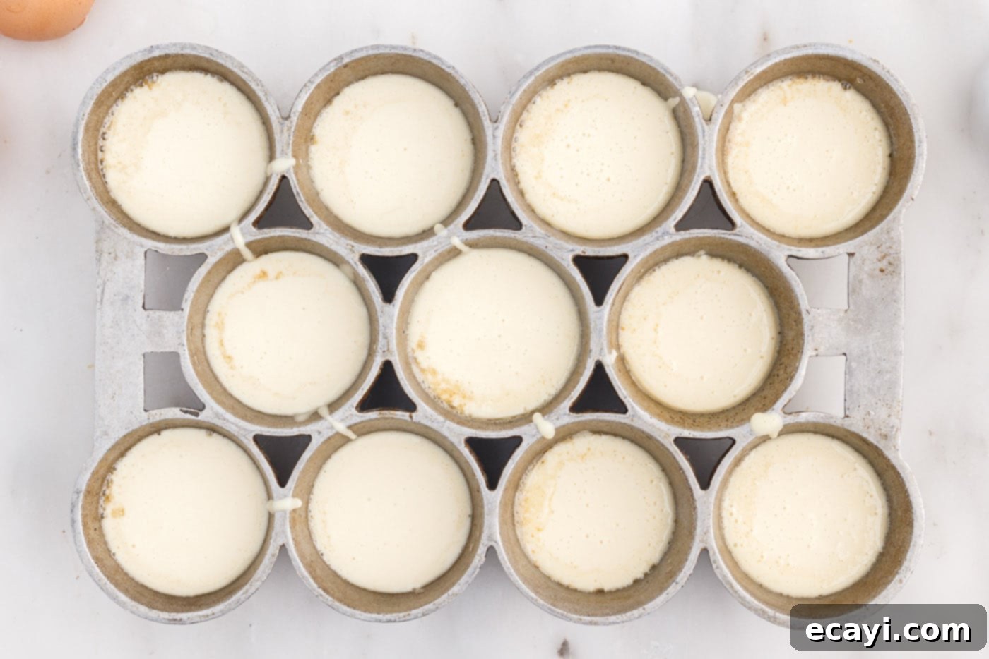 Light and Airy Popovers 10 Easy popover batter filling the popover tin cups