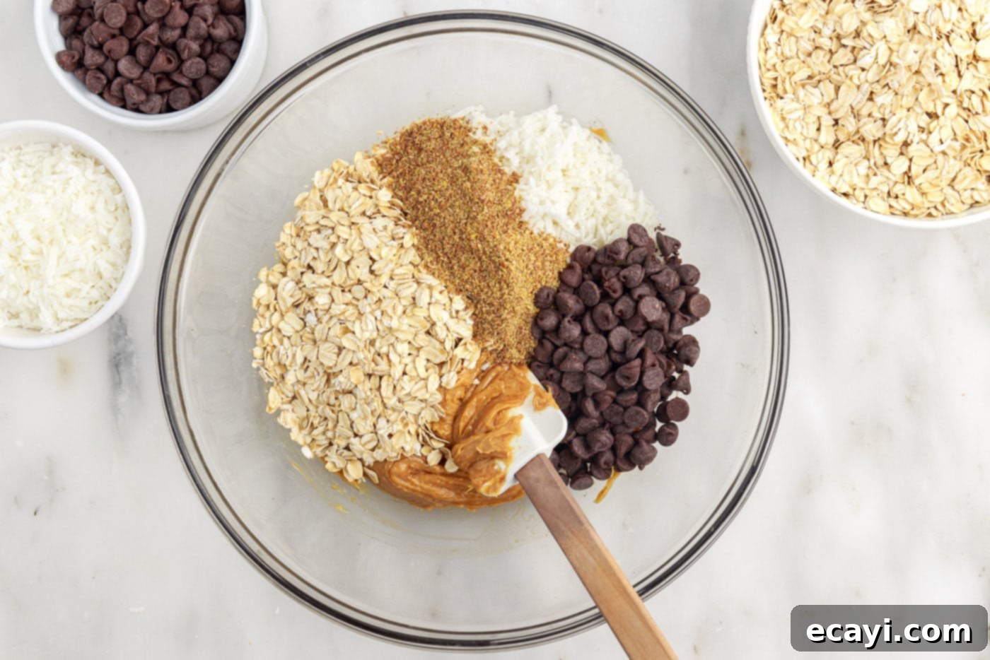 Effortless Energy Bites 6 no bake energy ball ingredients in a mixing bowl