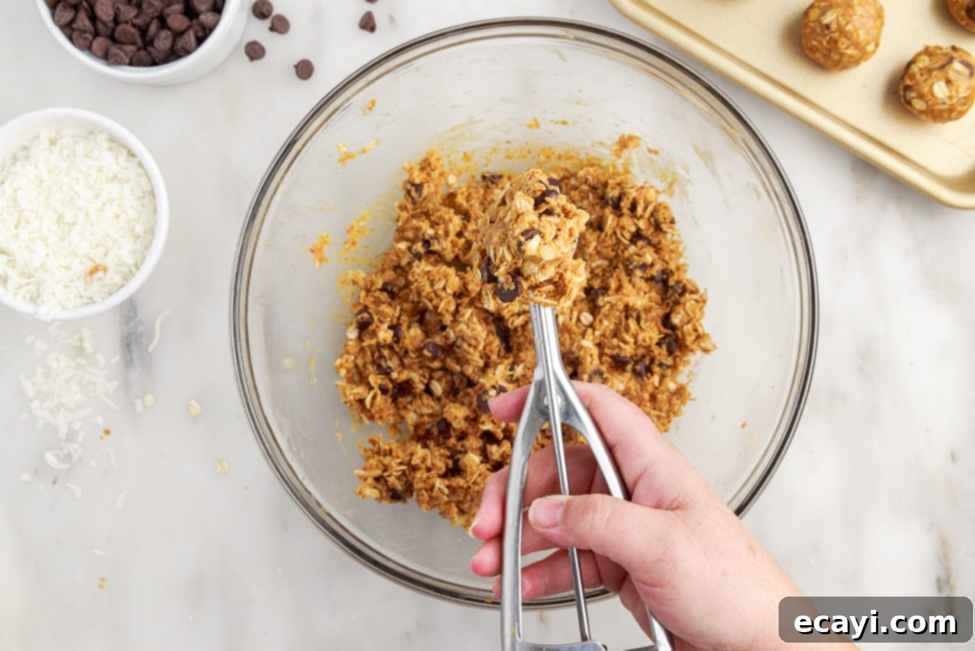 Effortless Energy Bites 7 scooping energy ball dough