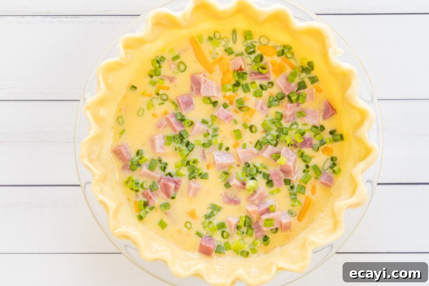 Savory Egg Custard Pie 10 Sliced green onions sprinkled on top of the quiche mixture as the final layer before baking.