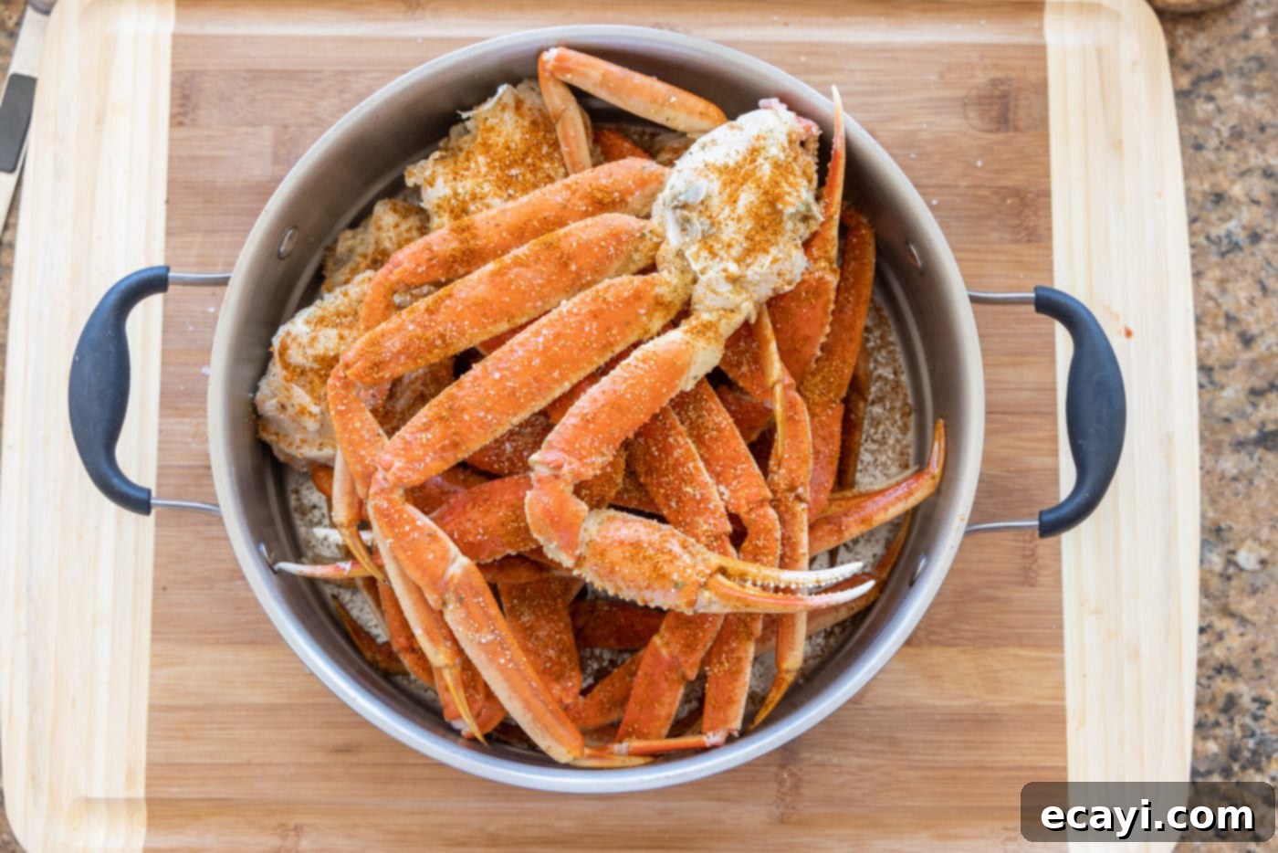 Arctic Crab Delights 7 Seasoned snow crab legs nestled in a steamer basket, ready for cooking