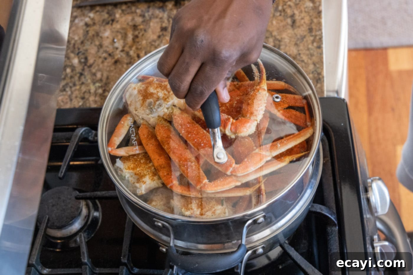 Arctic Crab Delights 8 Placing the lid securely on a steam pot containing snow crab legs