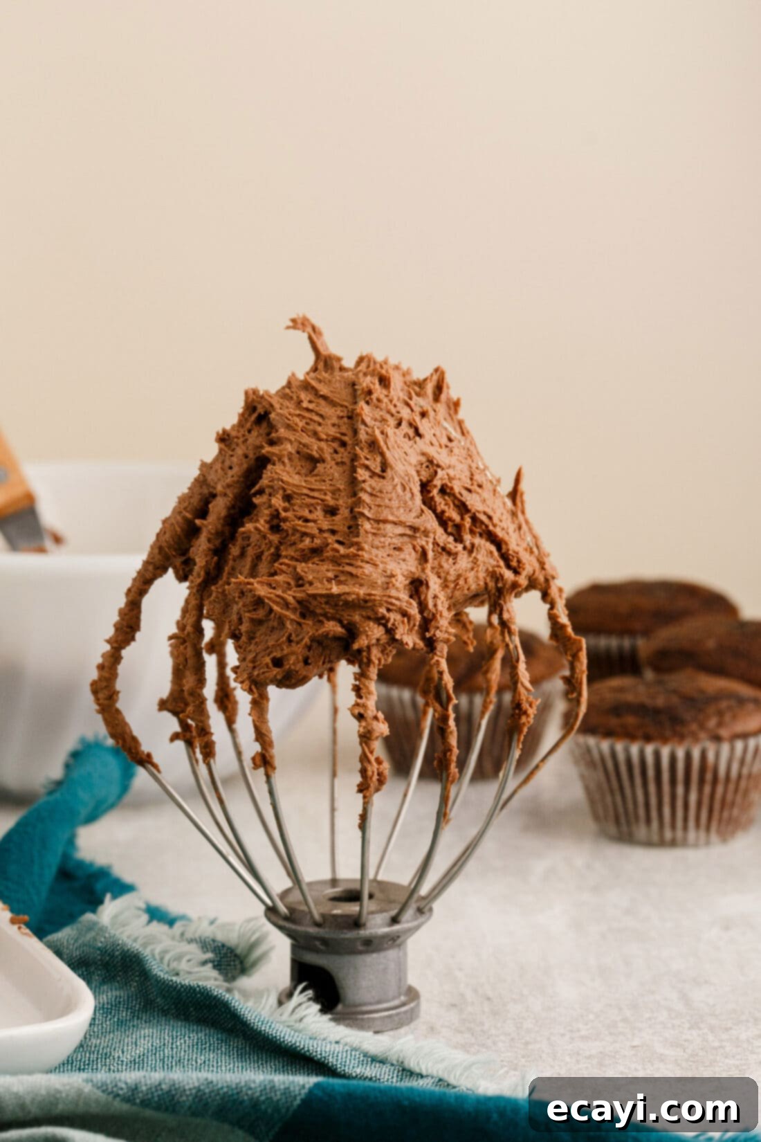 Velvety Chocolate Dream Frosting 3 Chocolate Buttercream Frosting on a mixer whisk