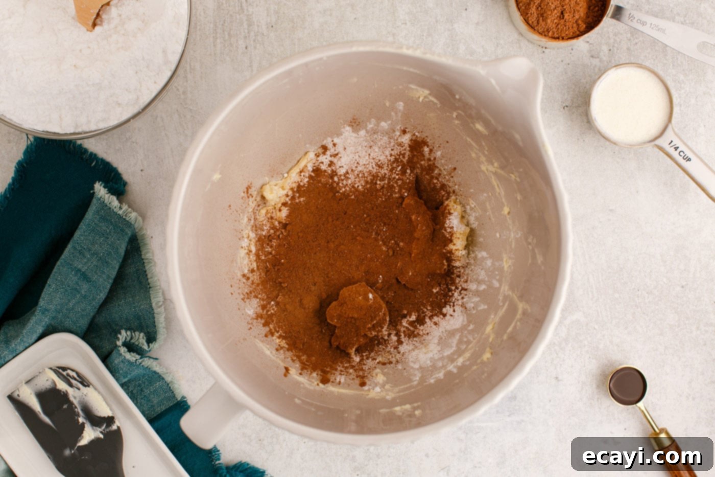 Velvety Chocolate Dream Frosting 6 cocoa powder, powdered sugar, and butter in a mixing bowl