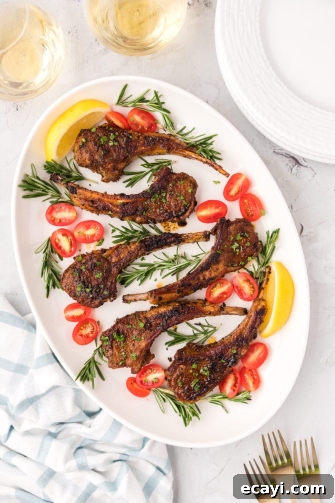 Tender Oven-Baked Lamb Chops 3 A serving platter showcasing several perfectly golden-brown baked lamb chops, ready to be enjoyed.