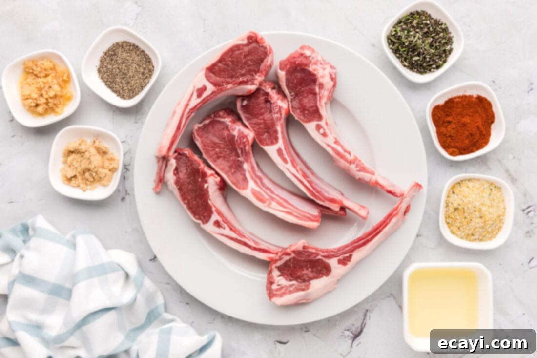 Tender Oven-Baked Lamb Chops 4 A collection of fresh ingredients laid out on a wooden board, including lamb chops, fresh rosemary, garlic, and various spices.