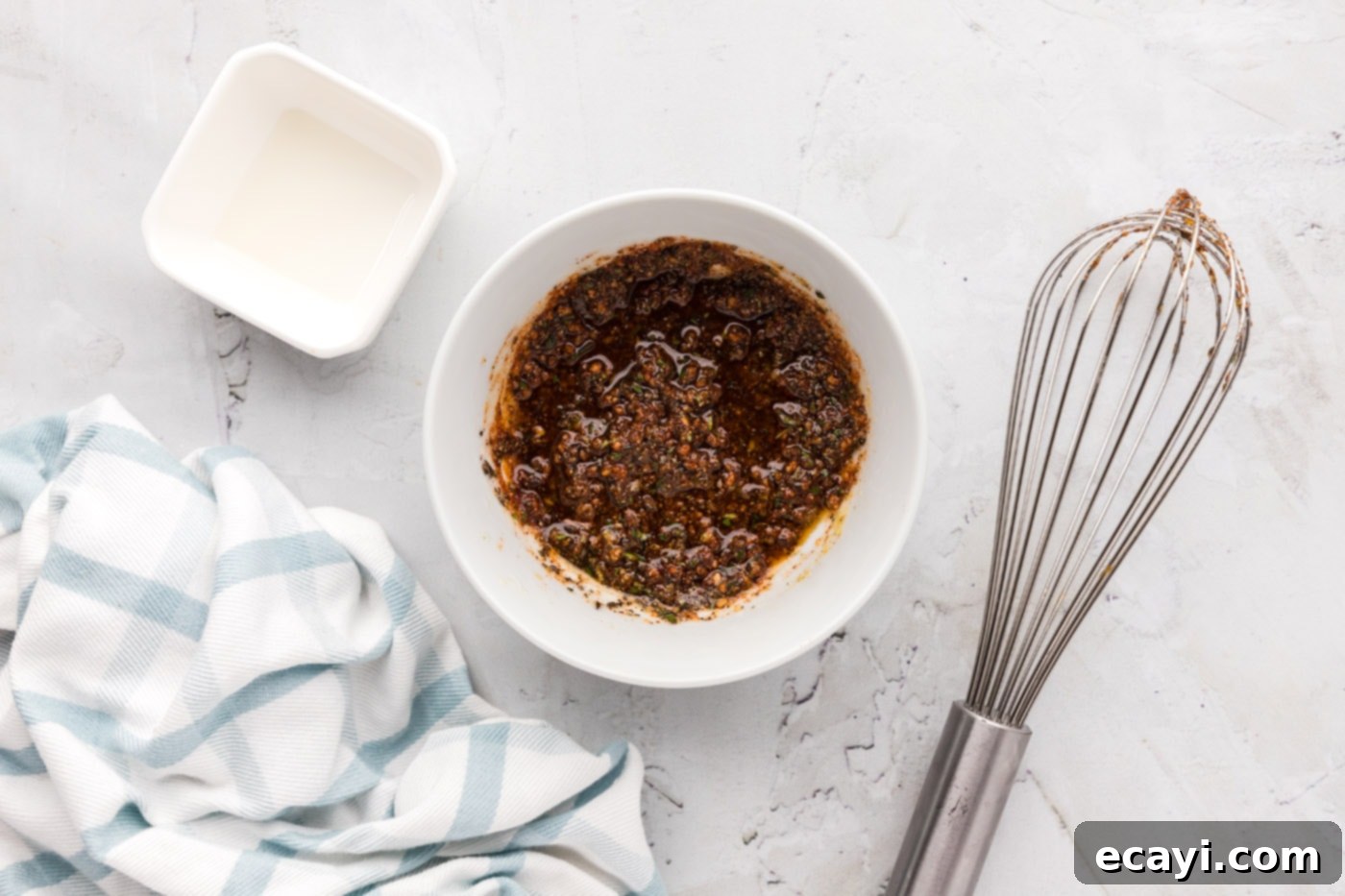 Tender Oven-Baked Lamb Chops 6 The whisked wet rub ingredients in a bowl, forming a thick, aromatic paste.