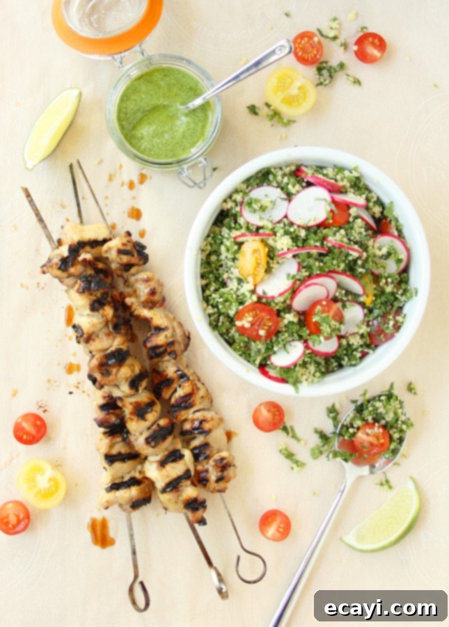 Fresh Cilantro Pesto Grilled Chicken Skewers with Kale Tabbouleh 2 Grilled Chicken Skewers with Cilantro Pesto and Kale Tabbouleh: A perfect summer meal combining tender chicken with vibrant flavors and a healthy side salad. FoodNouveau.com