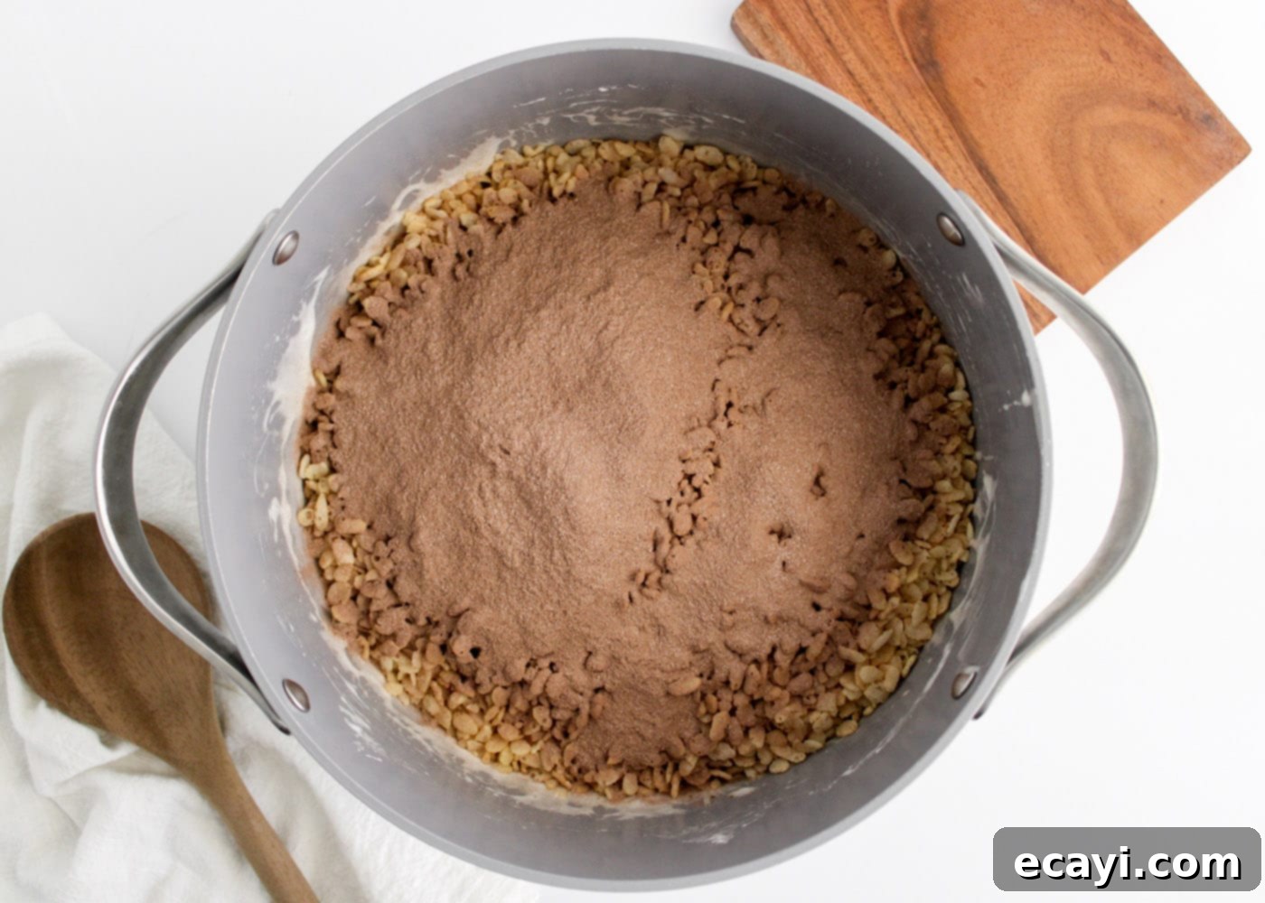Cozy Cocoa Krispie Squares 8 adding hot chocolate mix to the rice krispies and marshmallow mixture