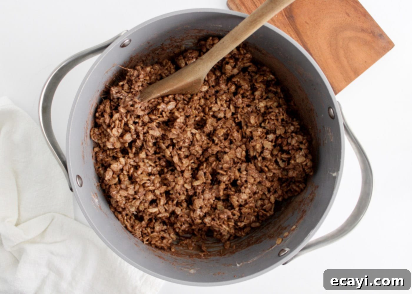 Cozy Cocoa Krispie Squares 9 hot chocolate rice krispie treats mixture in a saucepan, fully combined and ready for the pan