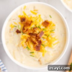 Loaded Baked Potato Soup 16 Bowl of homemade creamy baked potato soup with fresh toppings