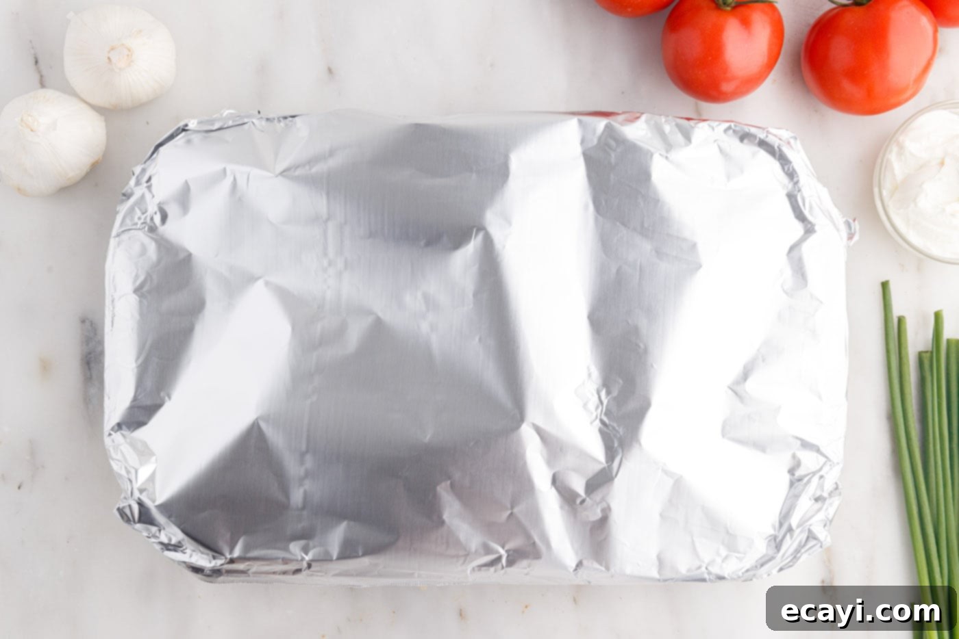 Tex-Mex Lasagna 13 Mexican lasagna casserole covered with aluminum foil before baking