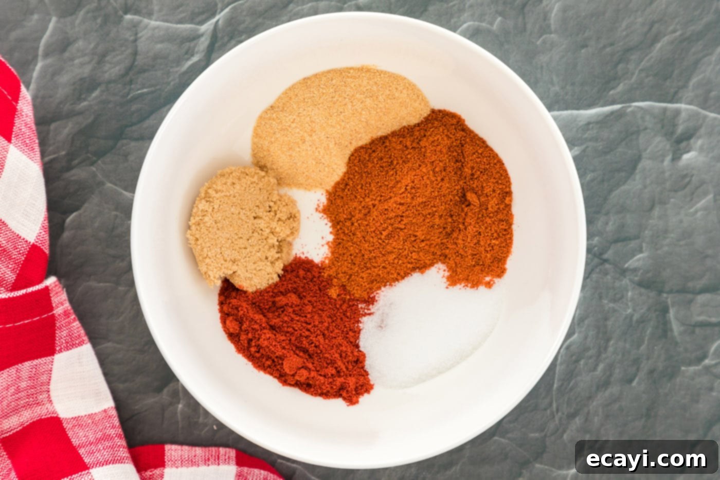 Nashville Hot Chicken 9 A bowl of dry spices including brown sugar, salt, garlic powder, cayenne, and paprika for the Nashville Hot Chicken sauce.