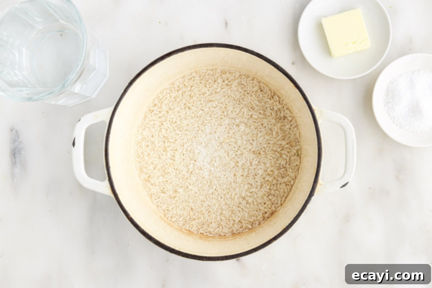 Perfect Fluffy Rice Every Time 7 white rice measured in a medium saucepan