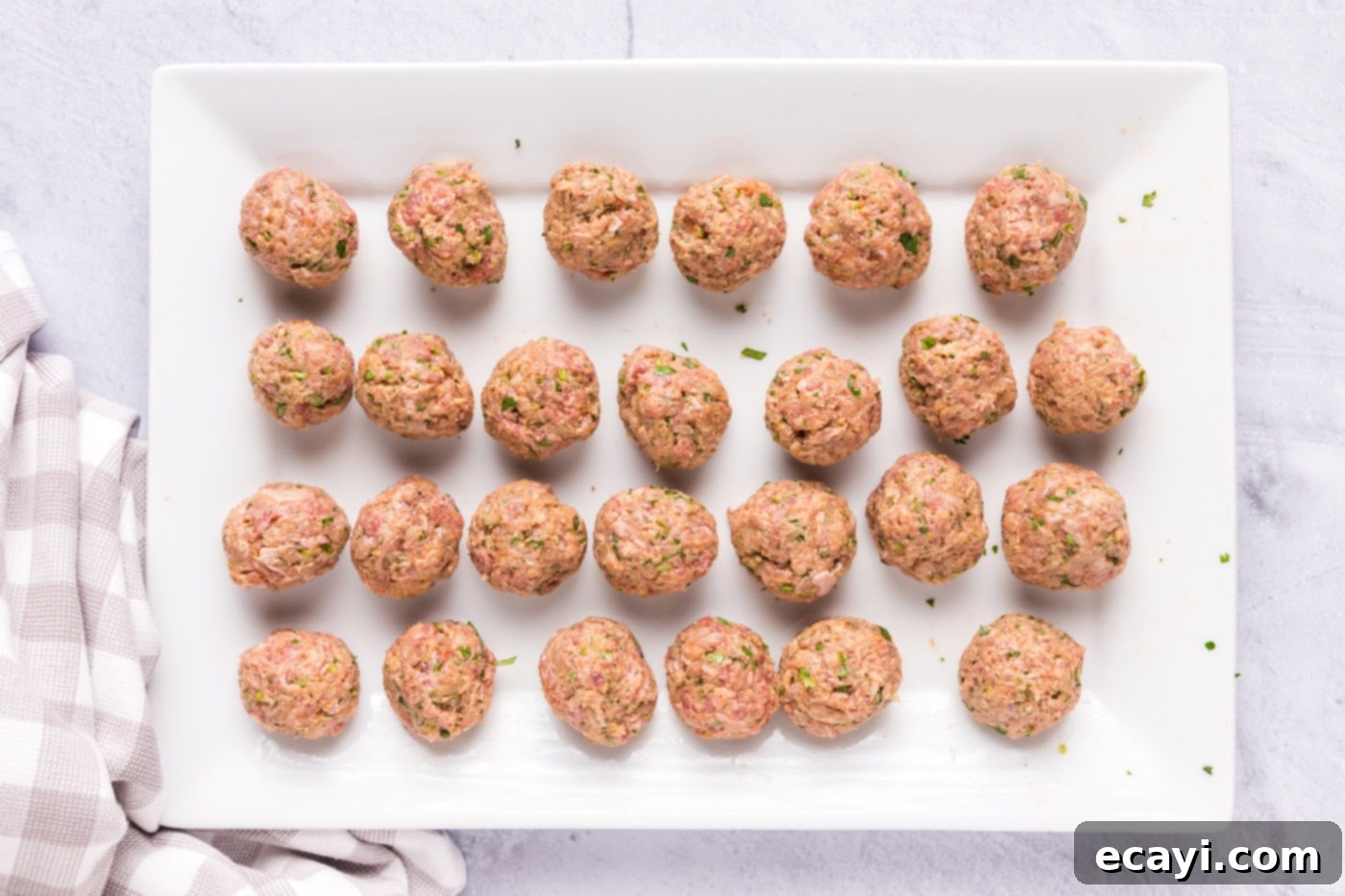 Aromatic Lamb Kofta 6 rolled lamb meatballs on a tray