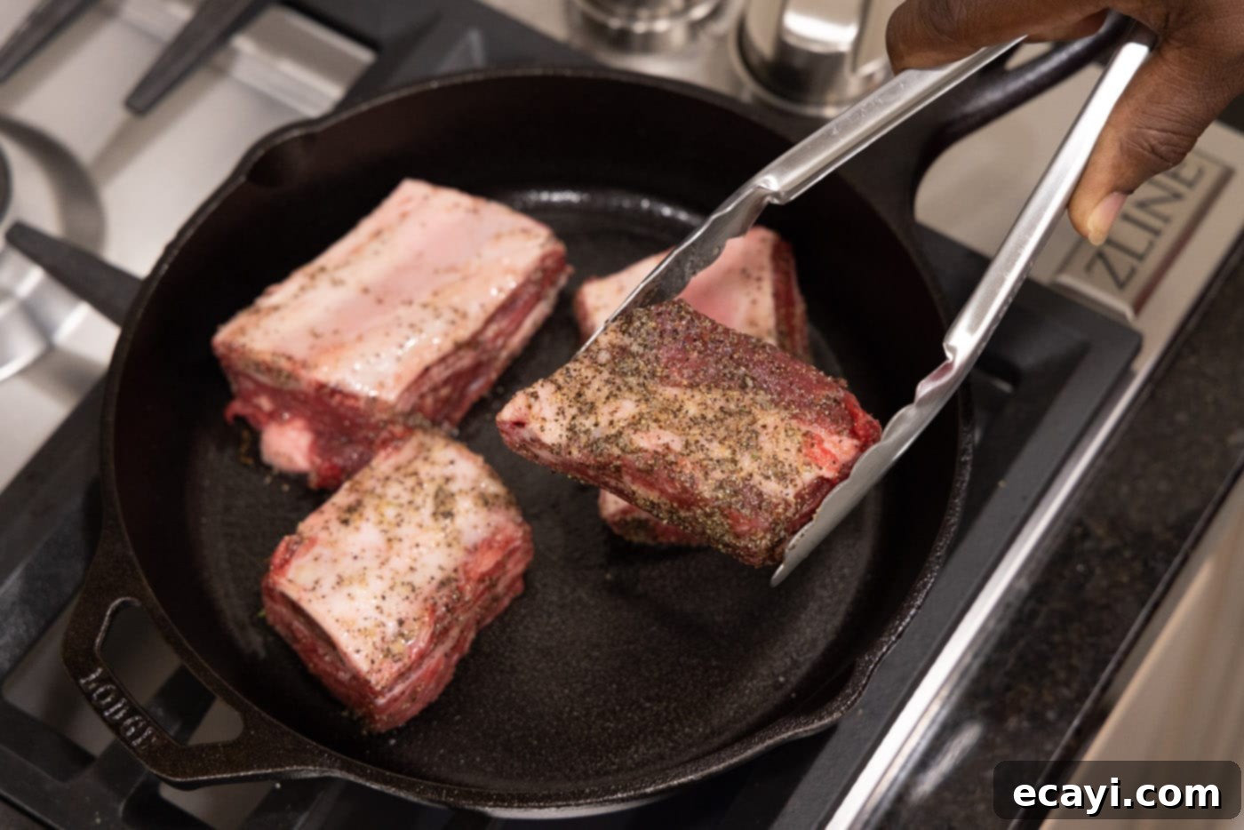 Slow-Cooked Beef Short Ribs 7 Searing beef short ribs in a skillet to develop a brown crust