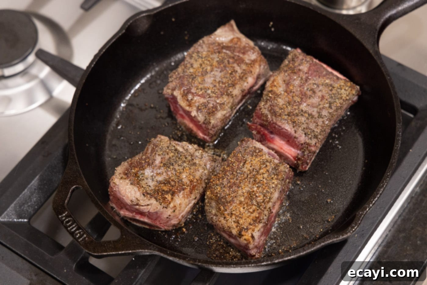 Slow-Cooked Beef Short Ribs 8 Browned beef short ribs in a skillet after searing