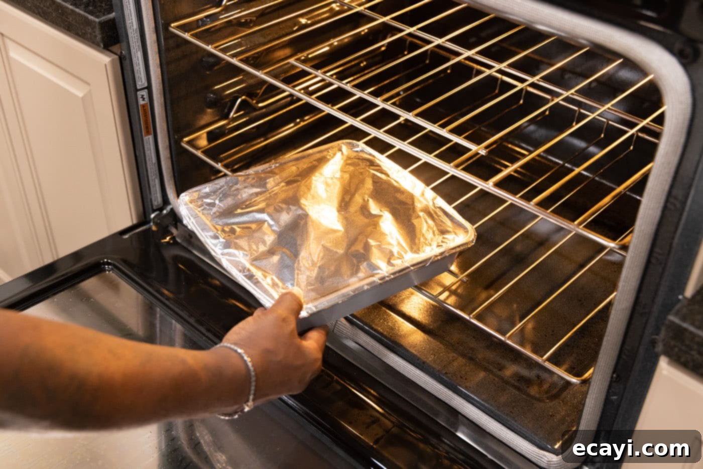 Slow-Cooked Beef Short Ribs 10 Putting short ribs in the oven, covered with aluminum foil