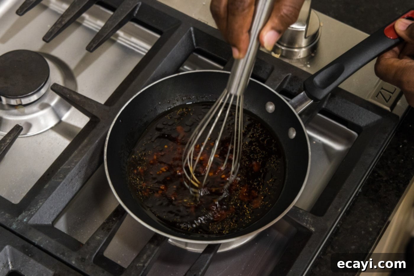 Velvet Salmon Glaze 6 whisking sauce in a skillet