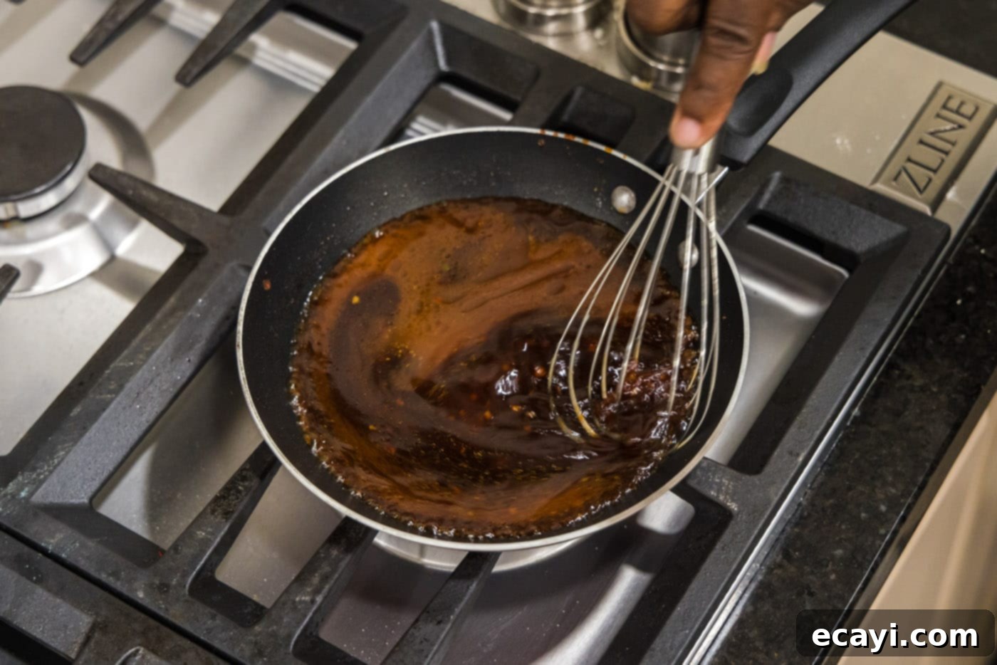Velvet Salmon Glaze 8 whisking salmon sauce in a skillet