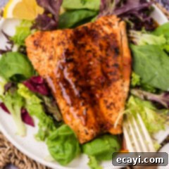 Velvet Salmon Glaze 10 Piece of salmon on a plate with Salmon Sauce on top
