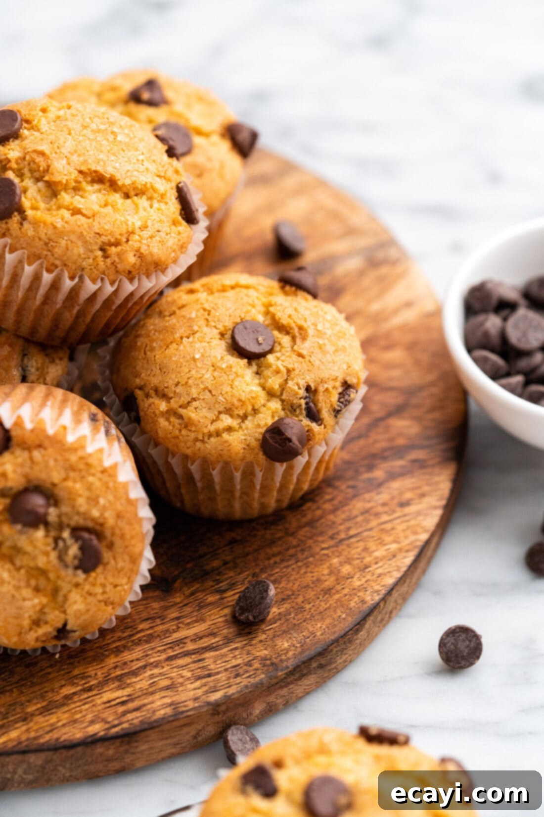 Heavenly Chocolate Chip Bites 2 Chocolate Chip Muffins on a wooden platter
