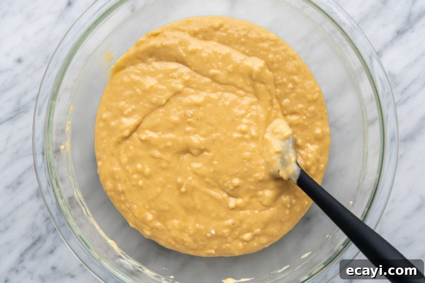 Heavenly Chocolate Chip Bites 11 muffin batter in a bowl with a rubber spatula