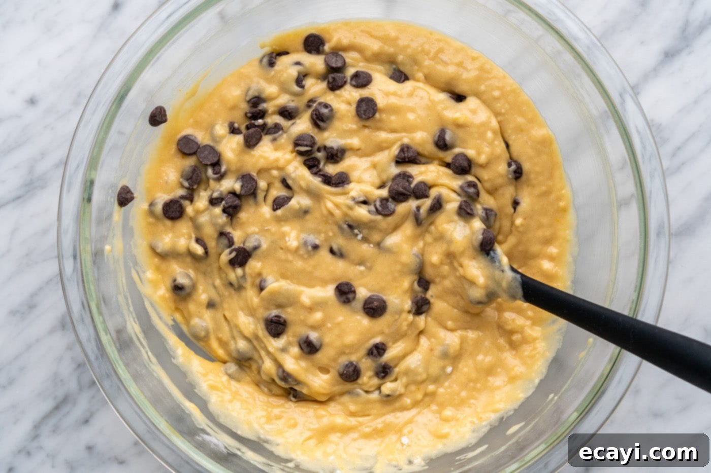 Heavenly Chocolate Chip Bites 12 mixing chocolate chips into muffin batter