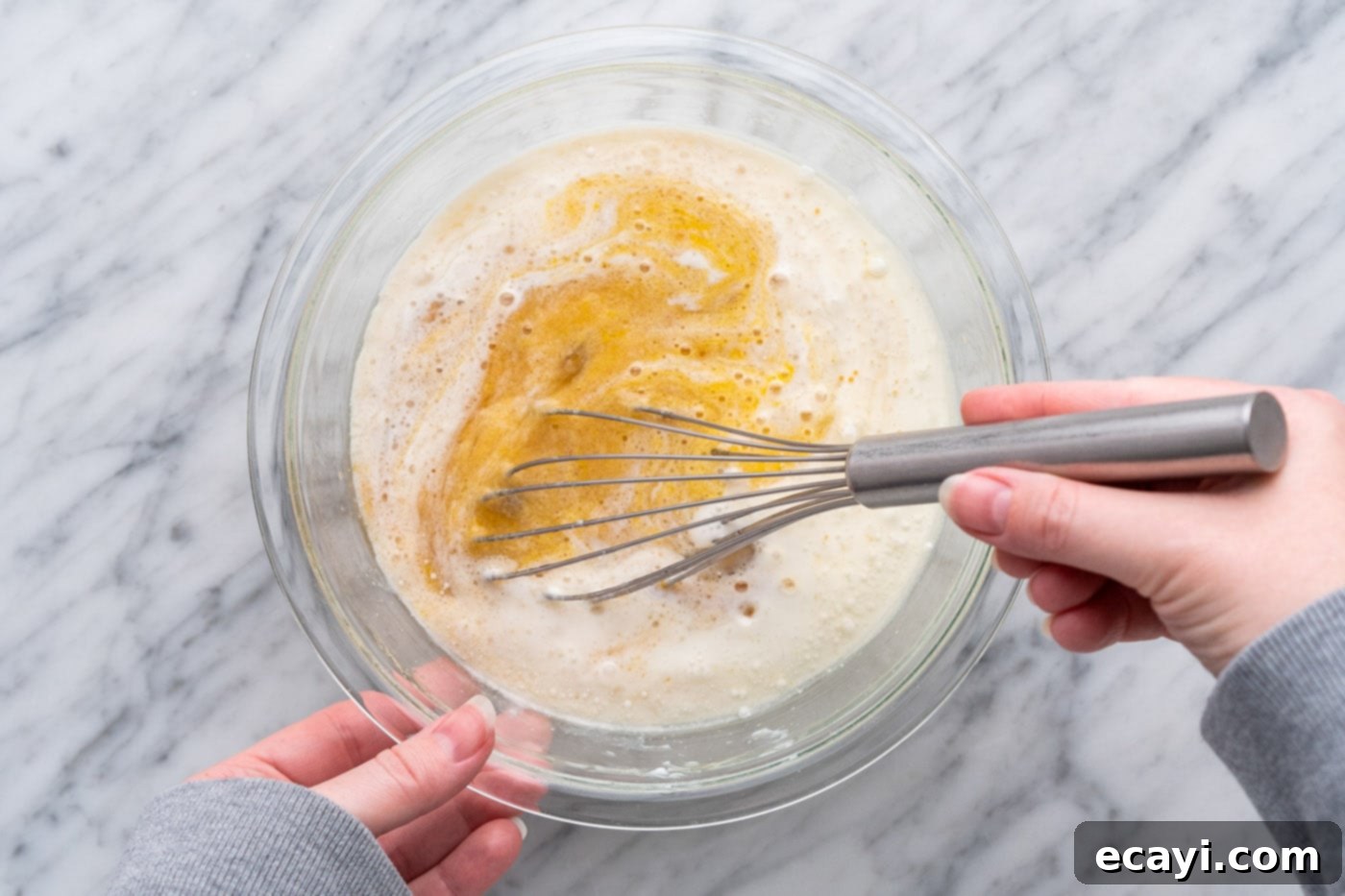 Heavenly Chocolate Chip Bites 6 whisking muffin ingredients in a bowl