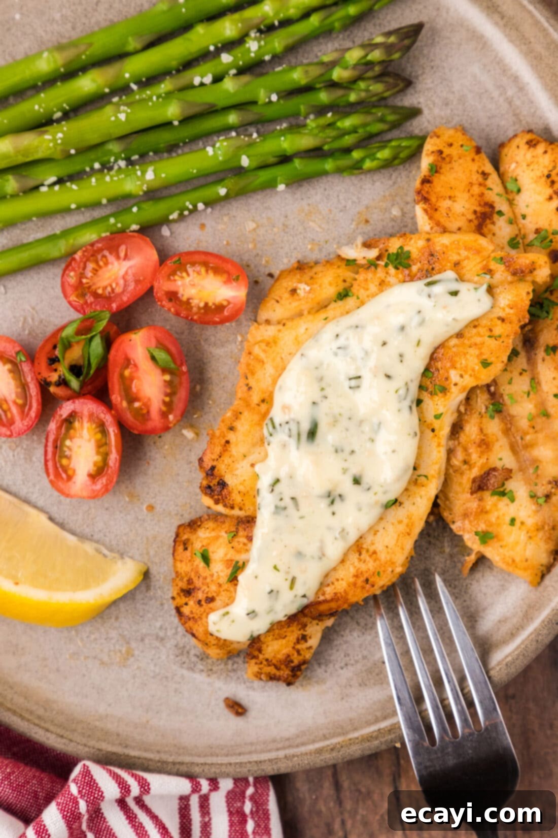 The Ageless Orange of the Depths 3 Pan-Seared Orange Roughy on a plate topped with creamy rosemary sauce, ready to be served