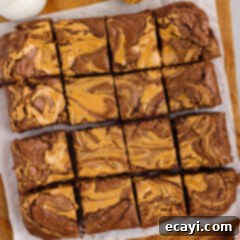 Peanut Butter Brownie Bliss 16 Peanut Butter Brownies cut up into squares on a wooden platter