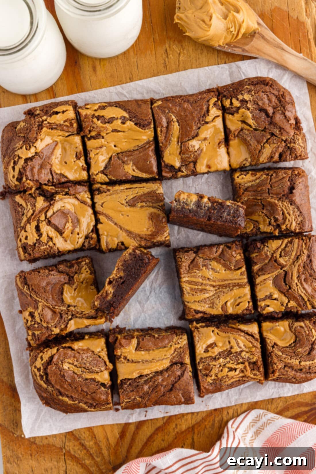 Peanut Butter Brownie Bliss 3 Pan of Peanut Butter Brownies cut up on a wooden platter